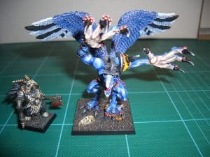 Daemon Prince (front) and beastman